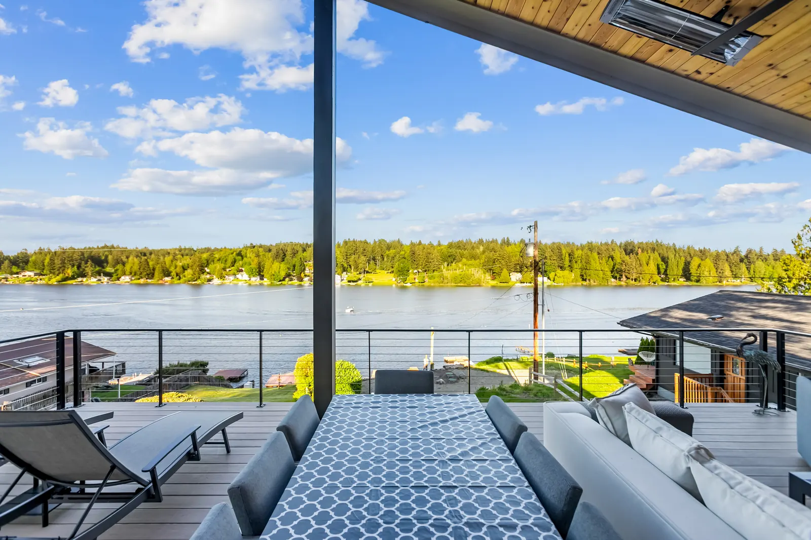 Upper deck dining and lounge seating overlooking Long Lake
