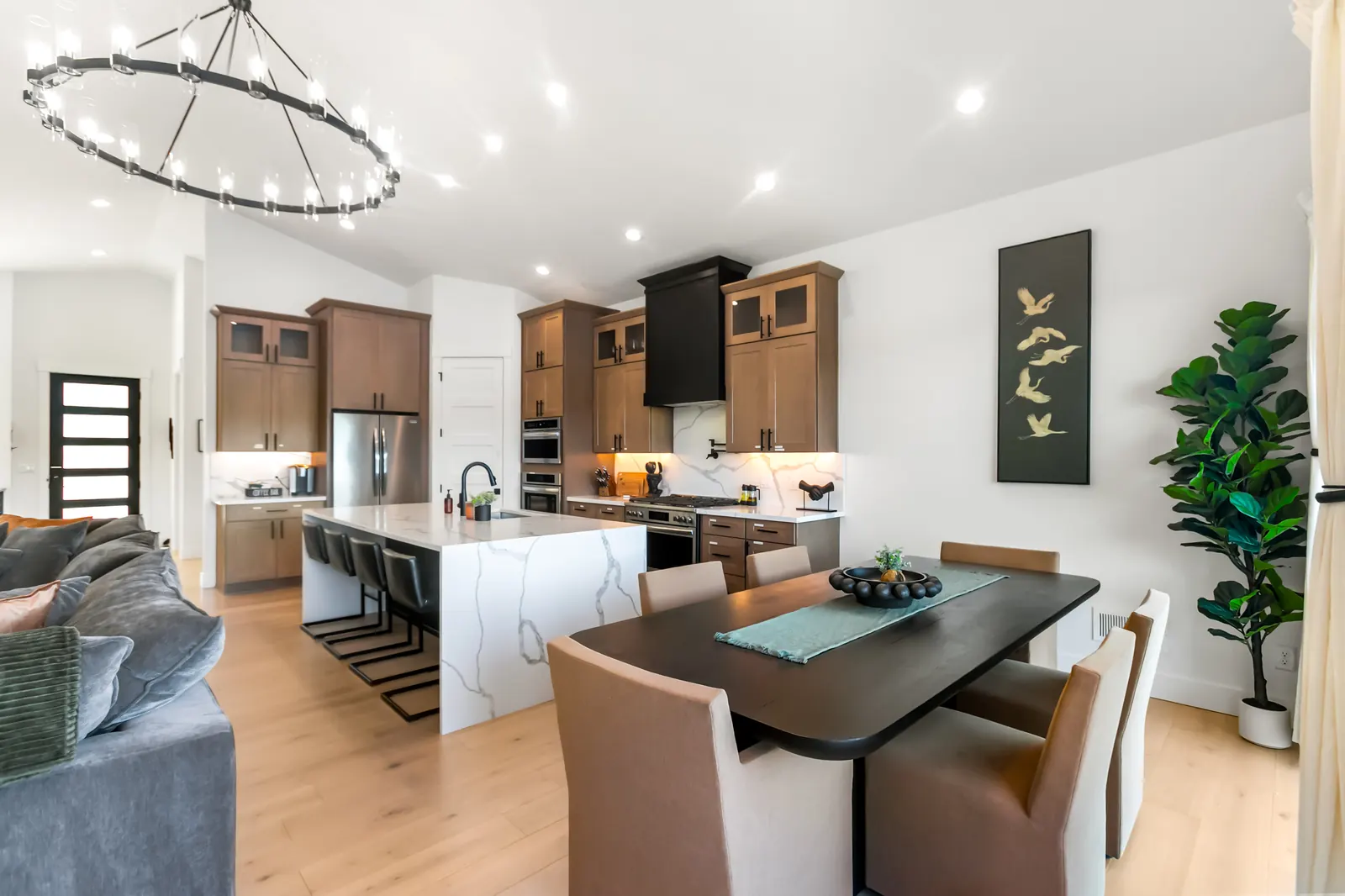 Open kitchen and living area with waterfall marble island
