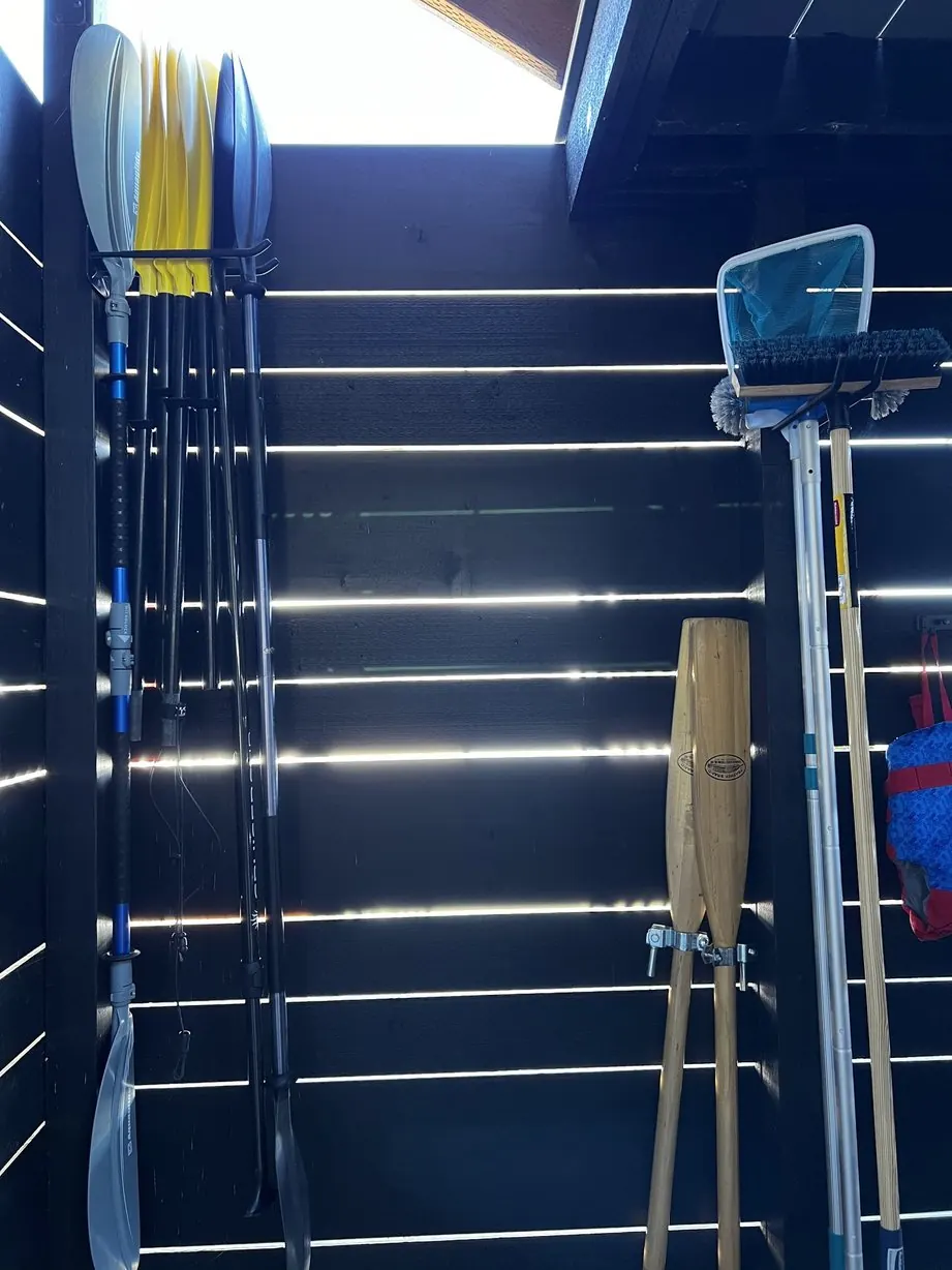 Outdoor shed for paddles and water gear